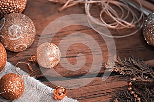 Fur tree branches, balls, rope on rustic wooden table background