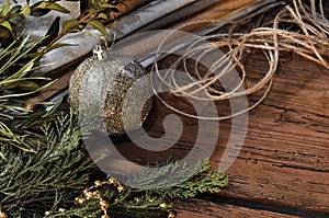 Fur tree branches, balls, rope on rustic wooden table background