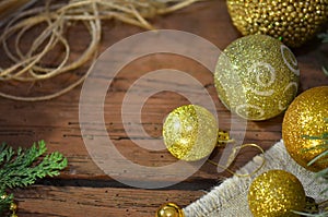 Fur tree branches, balls, rope on rustic wooden table background