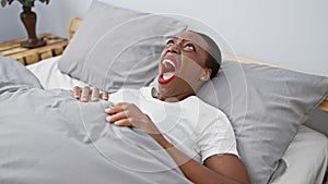 Furious african american woman in bedroom, a portrait of frustration, anger, and rage