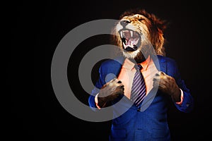 Furious angry businessman with face of lion roar