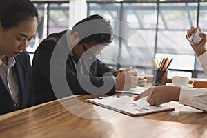 Furious boss scolding frustrated woman at office. irritated man