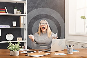 Furious business woman shouting at work place