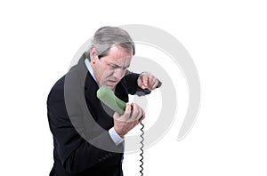 Furious businessman shouting on the phone