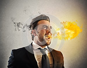 Furious businessman spitting fire