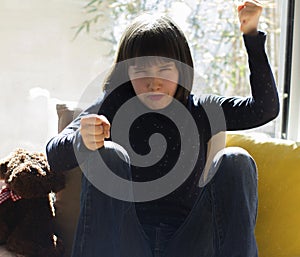 Furious child fighting against domestic violence and lonely virus shutdown photo