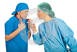 Furious doctors women argue photo