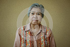 Furious elder woman. enraged elderly female. angry asian senior
