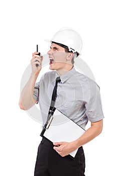 Furious engineer using walkie talkie.