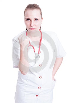 Furious and frustrated woman doctor showing threatening fist