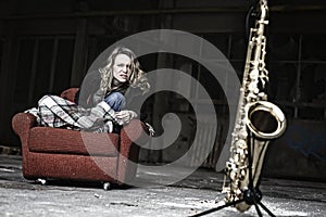 Furious girl starring at saxophone