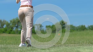 Furious with her miss girl throwing golf club to grass, failed attempt, loser