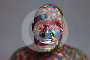 Furious villain colorful face looking at you