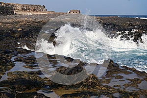 furious wave crashes on the coast