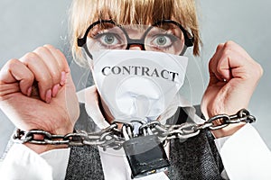 Furious woman with chained hands and contract