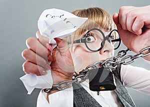 Furious woman with chained hands and contract