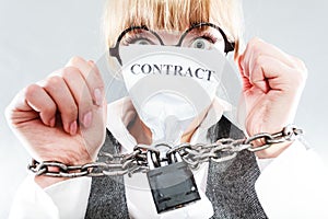 Furious woman with chained hands and contract