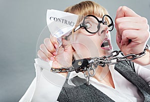 Furious woman with chained hands and contract