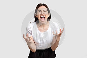 Furious woman portrait nervous breakdown yelling