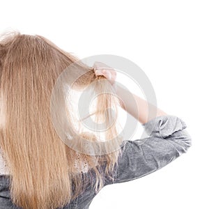 Furious woman pull hair out of head.