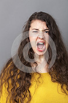 Furious young woman having a nervous breakdown