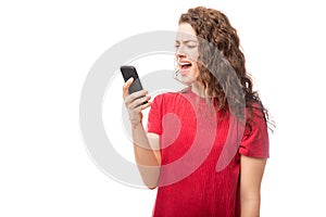 Angry woman yelling at her cell phone
