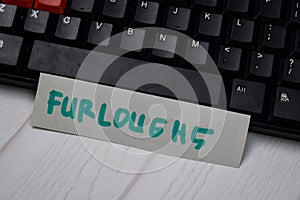 Furloghs write on sticky notes isolated on keyboard computers