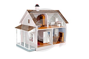 Furnished pink doll house on white