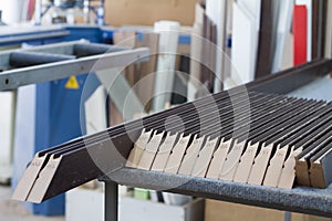 Furniture accessories. Manufacture of skirting boards in a furniture factory.