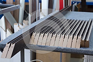 Furniture accessories. Manufacture of skirting boards in a furniture factory.