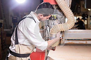 Furniture factory, Small-Sized Companies and people concept - Serious concentrated handsome bearded worker of furniture