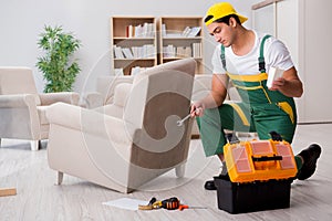 The furniture repairman repairing armchair at home