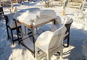 Furniture in Snowy summer cafÃ© in the center of the old town of Pomorie in Bulgaria, winter