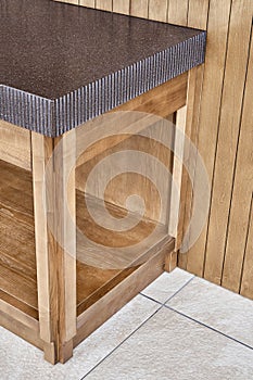 Furniture of toned ash timber in cookhouse on open terrace