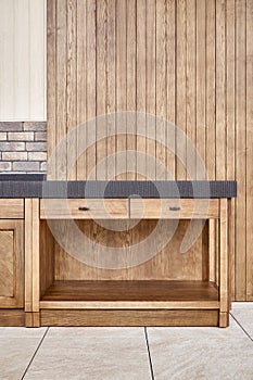 Furniture of toned ash timber in cookhouse on open terrace photo