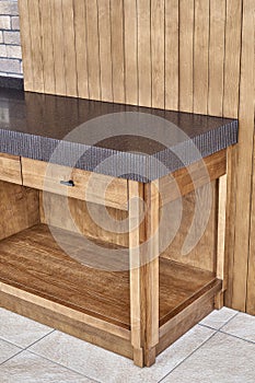 Furniture of toned ash timber in cookhouse on open terrace photo