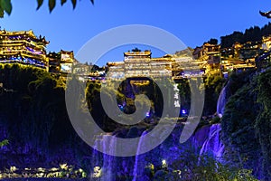 Furong Town, CHINA - OCTOBER 21th, 2023: Furong Ancient Town illuminated at night. Amazing beautiful landscape scene of Furong