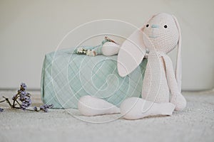 Furoshiki Japanese Gift fabric Wrapping and knitted toy rabbit. Zero waste, eco-friendly gift wrapping box. Fall hand