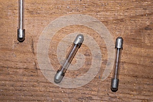 Fuse on wood background. safety device for overcurrent protection. protection of an electrical circuit