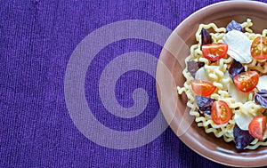 Fusilli lunghi with cheese and cherry tomatoes