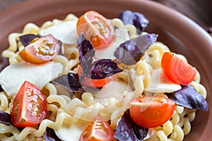 Fusilli lunghi with cheese and cherry tomatoes