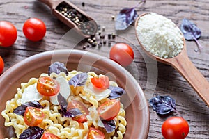 Fusilli lunghi with cheese and cherry tomatoes