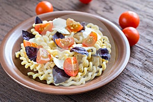 Fusilli lunghi with cheese and cherry tomatoes