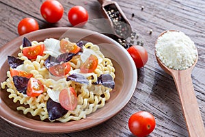 Fusilli lunghi with cheese and cherry tomatoes