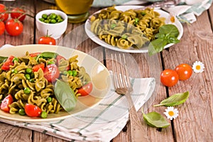 Fusilli pasta with cherry tomatoes and peas