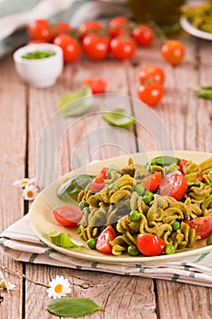 Fusilli pasta with cherry tomatoes and peas