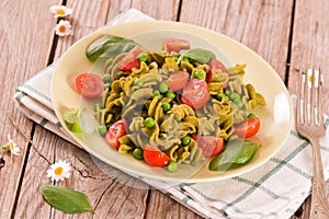 Fusilli pasta with cherry tomatoes and peas