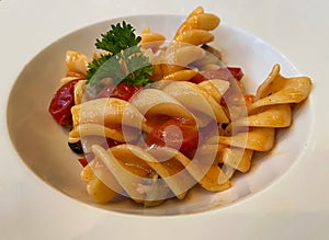 Fusilli Pasta di Gragnano with cherry tomatoes and seafood in scented oil