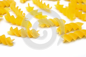 Fusilli pasta on a white background