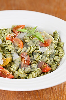 Fusilli with pesto, cherry tomatoes and parmesan